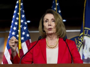 FILE - In this Sept. 6, 2018, file photo. House Minority Leader Nancy Pelosi, D-Calif., speaks during her weekly news conference on Capitol Hill in Washington. Just ahead of a midterm election they hope will deliver them a majority, House Democrats are promising to prioritize anti-discrimination legislation that would for the first time establish widespread equal rights protections for LGBTQ individuals. Pelosi says she will introduce the Equality Act as one of her first orders of business if Democrats retake the House in November.