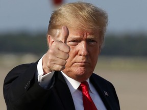 President Donald Trump gives thumbs up as he steps off Air Force One as he arrives Monday, Oct. 8, 2018, at Andrews Air Force Base, Md. Trump is returning from Orlando, Fla.   Forget "Obamacare." President Donald Trump has found a new target when it comes to ideas from the Democrats for the nation's health care system. Before the midterm elections, Trump is going after "Medicare for All," the rallying cry of Sen. Bernie Sanders.