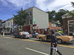 This image provided by Erin Aulov shows a scene on Wisconsin Avenue in the Georgetown section of Washington on June 14, 2018, during the filming of the new Wonder Woman movie. When the Wonder Woman sequel filmed in several locations around Washington this summer, it was a genuine novelty. In any given year, there are usually multiple movies and TV shows set in Washington, but very few actually do the bulk of their filming here.