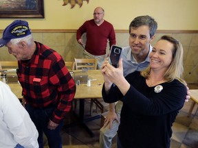 FILE - In this Sunday, Jan. 7, 2018, file photo, Texas Democratic Congressman Beto O'Rourke, second from right, poses for a photo following a town hall meeting at a restaurant in Falfurrias, Texas. For many Democrats, Beto O'Rourke's response to a question about NFL players kneeling during the national anthem was the type of moment that will be essential for a field that will challenge President Donald Trump beginning after the November elections. If there's a common buzzword in Democratic politics right now, it's "authenticity," or the desire to present candidates in an unvarnished manner that's true to themselves.