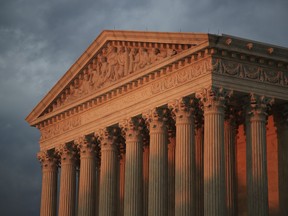 The U.S. Supreme Court is seen at sunset in Washington, Thursday, Oct. 4, 2018.