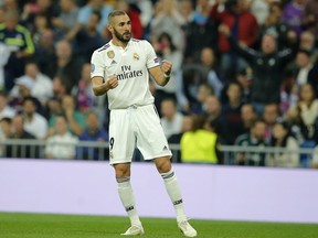 Real's Karim Benzema celebrates after scoring his side's opening goal during the Champions League, group G, soccer match between Real Madrid and Viktoria Plzen at the Santiago Bernabeu stadium in Madrid, Spain, Tuesday Oct. 23, 2018.