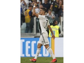 Juventus' Cristiano Ronaldo celebrates after scoring his team's first goal during an Italian Serie A soccer match between Juventus and Genoa, at the Alliance stadium in Turin, Italy, Saturday, Oct. 20, 2018.