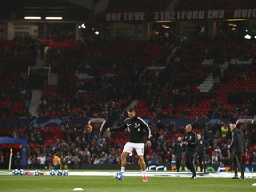 Juventus forward Cristiano Ronaldo kicks a ball during warmup before the Champions League group H soccer match between Manchester United and Juventus at Old Trafford, Manchester, England, Tuesday, Oct. 23, 2018.