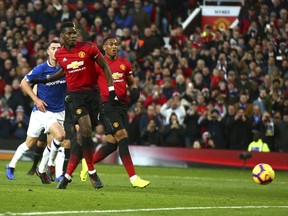 Manchester United's Paul Pogba scores the opening goal during the English Premier League soccer match between Manchester United and Everton FC at Old Trafford in Manchester, England, Sunday Oct. 28, 2018.