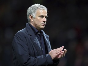 ManU coach Jose Mourinho leaves the field at the end of the Champions League group H soccer match between Manchester United and Valencia at Old Trafford Stadium in Manchester, England, Tuesday Oct. 2, 2018.