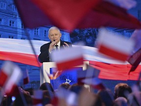 FILE - In this Sept. 2, 2018 file photo Jaroslaw Kaczynski, leader of the ruling Law and Justice party speaks during his party's electoral convention ahead of the Oct. 21 local elections, in Warsaw, Poland. Poland's ruling conservative Law and Justice party, whose policies have drawn massive street protests and repeated clashes with its European Union partners, faces a major test of support in Sunday's local elections, the first in a string of votes that can strengthen or chip its firm grip on power.