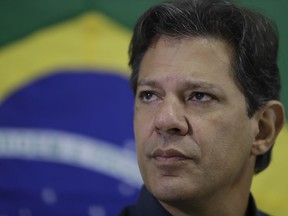 Fernando Haddad, Workers' Party presidential candidate, listens to a question during a press conference in Sao Paulo, Brazil, Monday, Oct. 15, 2018. Haddad will face Jair Bolsonaro, the far-right congressman in a presidential runoff on Oct. 28.