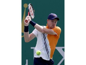 Kyle Edmund of Britain hits a return shot to Nicolas Jarry of Chile during their men's singles match of the Shanghai Masters tennis tournament at Qizhong Forest Sports City Tennis Center in Shanghai, China, Thursday, Oct. 11, 2018.