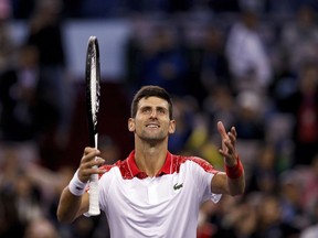 Novak Djokovic of Serbia gestures to spectators after winning his men's singles semifinals match against Alexander Zverev of Germany in the Shanghai Masters tennis tournament at Qizhong Forest Sports City Tennis Center in Shanghai, China, Saturday, Oct. 13, 2018.