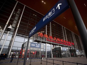 A security officer stands guard at the main entrance of the immigration building for the China-Zhuhai-Macau-Hong Kong Bridge ahead of the opening ceremony in Zhuhai in south China's Guangdong province, Tuesday, Oct. 23, 2018. The bridge, the world's longest cross-sea project, which has a total length of 55 kilometers (34 miles), will have opening ceremony in Zhuhai on Tuesday.