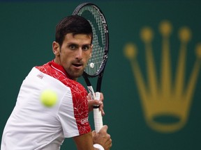 Novak Djokovic of Serbia eyes on the ball as he plays against Borna Coric of Croatia during their men's singles finals match in the Shanghai Masters tennis tournament at Qizhong Forest Sports City Tennis Center in Shanghai, China, Sunday, Oct. 14, 2018.