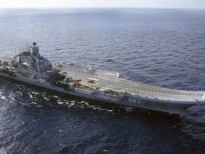 FILE - This 2004 file photo shows the Admiral Kuznetsov aircraft carrier in the Barents Sea, Russia. A Russian official says one person is missing and four have been injured in an accident that damaged Russia's only aircraft carrier. (AP Photo, File)
