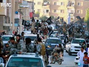 FILE - In this undated file image posted on Monday, June 30, 2014, by the Raqqa Media Center of the Islamic State group, which has been verified and is consistent with other AP reporting, fighters from the Islamic State group parade in Raqqa, north Syria. With Islamic State's near total defeat on the battle field, the extremist group has reverted to what it was before its spectacular series of conquests in 2014 _ a shadowy terror network that targets vulnerable civilian populations and exploits state weaknesses to incite on sectarian strife. But a recent surge in false claims of responsibility for attacks also signals that the group is struggling to stay relevant after losing its proto-state and its dominance of the international news agenda. (AP Photo/Raqqa Media Center of the Islamic State group, File)