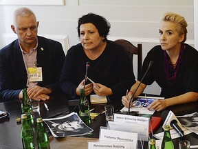 Marek Lisicki, left, a victim of church sex abuse and head of a foundation representing victims, activist Agata Diduszko-Zyglewska, center, and opposition lawmaker Joanna Scheuring-Wielgus,right, during a meeting that demanded strict criminal punishment for pedophile priests at the parliament in Warsaw, Poland, Monday, Oct. 8, 2018.