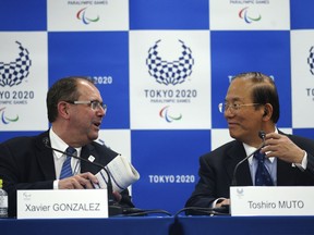 Xavier Gonzalez, left, CEO of the International Paralympic Committee (IPC), and Toshiro Muto, right, CEO of the Tokyo Organizing Committee of the Olympic and Paralympic Games (Tokyo 2020) chat after their IPC and Tokyo 2020 joint press conference in Tokyo, Friday, Oct. 19, 2018.