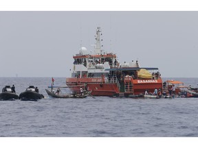 Rescuers conduct a search operation for the victims of the crashed Lion Air plane in the waters of Tanjung Karawang, Indonesia, Tuesday, Oct. 30, 2018. Divers searched Tuesday for victims of the Lion Air plane crash and high-tech equipment was deployed to find its data recorders as reports emerged of problems on the jet's previous flight that had terrified passengers.