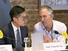 In this Aug. 14, 2018, image made from a video, The Financial Times Asia news editor, Victor Mallet, right, speaks with Andy Chan, founder of the Hong Kong National Party, during a luncheon at the Foreign Correspondents Club in Hong Kong. The Financial Times said Friday, Oct. 5, 2018 that Hong Kong's government has refused to renew the work visa of Mallet, in what human rights activists say is the latest sign of a deteriorating human rights situation in the semi-autonomous Chinese territory. (Pool video via AP)