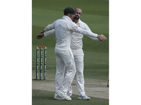 Australia's Nathan Lyon celebrates the dismissal of Pakistan's Haris Sohail during their cricket test match in Abu Dhabi, United Arab Emirates, Thursday, Oct. 18, 2018.