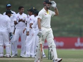 Australia's Mitchell Marsh walks from the pitch after being dismissed in the test match against Pakistan in Abu Dhabi, United Arab Emirates, Friday, Oct. 19, 2018.