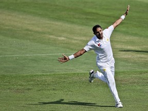 Pakistan's Mohammad Abbas celebrates dismissal of Australia's Shaun Marsh during their test match in Abu Dhabi, United Arab Emirates, Wednesday, Oct. 17, 2018.