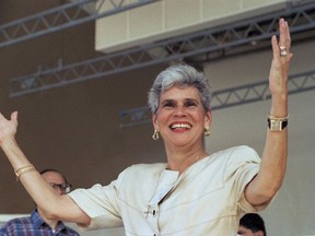 FILE - In this Sept. 17, 1989 file photo, Nicaraguan presidential candidate Violeta Chamorro raises her arms as she receives a warm welcome from some 2,000 Nicaraguan exiles who turned out in Miami for a rally and independence day celebration. Chamorro's family put out a statement on Oct. 1, 2018 that the former president has been hospitalized in Managua, Nicaragua where she is in "delicate condition" after a stroke.