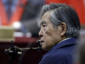 FILE - In this March 15, 2018 file photo, Peru's former President Alberto Fujimori listens to a question during his testimony in a courtroom at a military base in Callao, Peru. The country's high court has overturned on Wednesday, Oct. 3, the former strongman's medical pardon and orders his return to jail.
