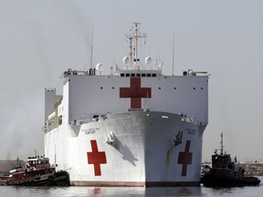 FILE - In this March 19, 2010 file photo, the Navy hospital ship USNS Comfort returns to port, in Baltimore, after providing disaster relief operations following the earthquake in Haiti. The Comfort will be on Colombia's Caribbean coast starting on Oct. 11, 2018, to assist in treating thousands of Venezuelan refugees that have crossed the border, fleeing Venezuela's political, social and economic crisis and help relieve the pressure on Colombia's medical systems