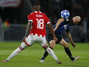 Inter midfielder Marcelo Brozovic, right, challenges for the ball with PSV's Pablo Rosario during a Group B Champions League soccer match between PSV and Inter Milan at the Philips stadium in Eindhoven, Netherlands, Wednesday, Oct. 3, 2018.
