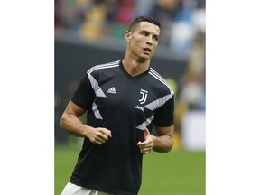 Juventus forward Cristiano Ronaldo warms up prior to the Serie A soccer match between Udinese and Juventus, at the Dacia Arena stadium in Udine, Italy, Saturday, Oct.6, 2018. Cristiano Ronaldo is back in Juventus' starting lineup, a week after a Nevada woman filed a civil lawsuit accusing him of rape nine years ago.