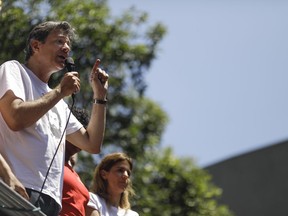 Fernando Haddad, presidential candidate for the Workers' Party, speaks to supporters as he campaigns in Rio de Janeiro, Brazil, Tuesday, Oct. 2, 2018. Haddad was hand-picked by Brazil's jailed, former President Luiz Inacio Lula da Silva to be their party's candidate in the Oct. 7 general elections.