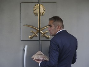 A security guard waits to enter Saudi Arabia's consulate in Istanbul, Wednesday, Oct. 10, 2018. Turkish officials have said they believe Saudi writer and government critic Jamal Khashoggi, was killed inside the consulate after he visited the mission to obtain a document required to marry his Turkish fiancee. Saudi Arabia has denied the allegations.