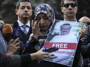 Holding a picture of missing Saudi writer Jamal Khashoggi, Tawakkol Karman, of Yemen the Nobel Peace Prize laureate for 2011, talks to members of the media near the Saudi Arabia consulate in Istanbul, Friday, Oct. 5, 2018. Khashoggi, a 59-year-old veteran journalist who has lived in self-imposed exile in the U.S. since Prince Mohammed's rise to power, disappeared Oct. 2 while on a visit to the consulate to get paperwork done to be married to his Turkish fiancée.