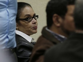 Guatemala's former Vice President Roxana Baldetti waits for the start of one of her several corruption trials in Guatemala City, Monday, Oct. 8, 2018. At this trial, Baldetti is accused of influencing the illegal awarding of a government contract to clean up lake pollution, and will learn if she's convicted or not.