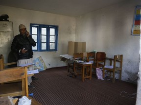 A Kashmiri poling officer inside a poling station during the first phase of local elections in Srinagar, Indian controlled Kashmir, Monday, Oct. 8, 2018. India says the polls are a vital grass roots exercise to boost development and address civic issues. Political separatist leaders and armed rebel groups who challenge India's sovereignty over Kashmir have called for a boycott, saying the polls are an illegitimate exercise under military occupation.