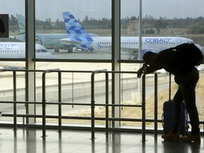 A Cobalt aircraft sits at Larnaca international airport in Cyprus, Thursday, Oct. 18, 2018. Cyprus-based airline Cobalt Air says it has indefinitely suspended all of its operations, Thursday, amid a struggle to find investors.