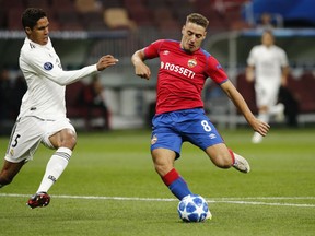 CSKA midfielder Nikola Vlasic, right, kicks the ball ahead of Real defender Raphael Varane during a Group G Champions League soccer match between CSKA Moscow and Real Madrid at the Luzhniki Stadium in Moscow, Russia, Tuesday, Oct. 2, 2018.
