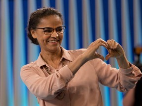 Marina Silva, presidential candidate of the Sustainability Network Party, gestures to the audience before a live, televised presidential debate in Rio de Janeiro, Brazil, Thursday, Oct. 4, 2018. Brazil will hold general elections on Oct. 7.