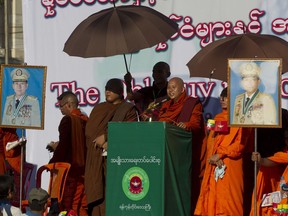 Buddhist monk and anti-Muslim community leader Wirathu speaks during a pro-military rally Sunday, Oct. 14, 2018, in front of city hall in Yangon, Myanmar. Several thousand pro-military and nationalist demonstrators marched through Yangon on Sunday voicing their support for Myanmar's armed forces and government while condemning foreign involvement in the country's affairs.