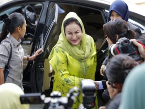 Rosmah Mansor, center, wife of Malaysian Prime Minister Najib Razak, arrives at the Anti-Corruption Agency for questioning in Putrajaya, Wednesday, Oct. 3, 2018. Rosmah is to be questioned by the country's anti-graft agency for the third time as investigators prepare possible charges against her including money laundering in the multi-billion-dollar scandal.