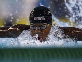 Mali swimmer Ousmane Toure competes in the Men's 100m Butterfly Heat at the Natatorium during the Youth Olympic Summer Games in Buenos Aires, Argentina, Monday, Oct. 8, 2018.