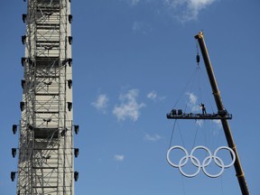 The olympic rings are craned into position at the Obelisk, in Buenos Aires, Argentina, Thursday, Oct. 4, 2018, two days ahead of the III Youth Olympic Games. Promoted by the International Olympic Committee, the summer games will gather close to 4,000 athletes from over 200 countries in Buenos Aires.