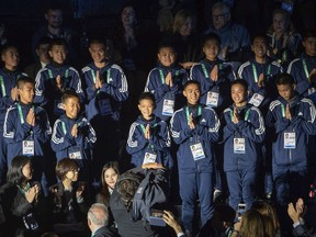 The young Thai football team The Wild Boars, who were rescued from Tham Luang cave in Thailand, attend the opening ceremony of The Youth Olympic Games, in Buenos Aires, Argentina, Saturday, Oct. 6, 2018.