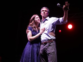 .S. Senate candidate Rep. Beto O'Rourke (D-TX) and wife Amy Sanders arrive onstage at Southwest University Park November 06, 2018 in El Paso, Texas.