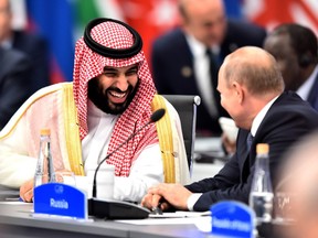 Crown Prince of Saudi Arabia Mohammad bin Salman al-Saud speaks with Russian President Vladimir Putin during the opening day of Argentina G-20 Leaders' Summit 2018 at Costa Salguero on November 30, 2018 in Buenos Aires, Argentina.