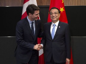 Canadian Prime Minister Justin Trudeau meets with Chinese Premier Li Keqiang before the Canada-China Annual Leaders dialogue in Singapore on Wednesday November 14, 2018.