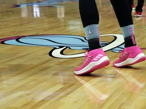 Miami Heat guard Goran Dragic warms up wearing pink shoes as the team unveiled its new Vice Nights City Edition uniforms before an NBA basketball game against the Indiana Pacers, Friday, Nov. 9, 2018, in Miami.