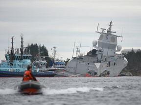 The Norwegian frigate "KNM Helge Ingstad" takes on water after collision with the tanker Sola TS on November 8, 2018 in the Hjeltefjord near Bergen.