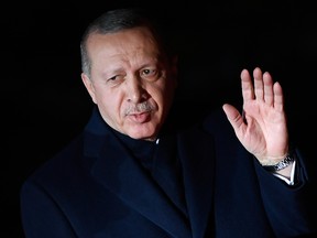 Turkish President Recep Tayyip Erdogan waves as he arrives at the Musee d'Orsay in Paris to attend a state diner and a visit of the Picasso exhibition as part of the ceremonies marking the 100th anniversary of the 11 November 1918 armistice, ending the First World War.