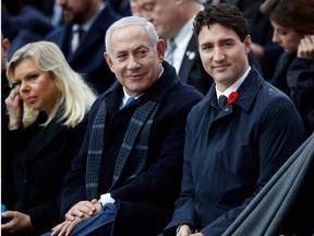 Israeli Prime Minister Benjamin Netanyahu, second left, and Canadian Prime Minister Justin Trudeau, third right, attend a ceremony at the Arc de Triomphe in Paris on November 11, 2018.